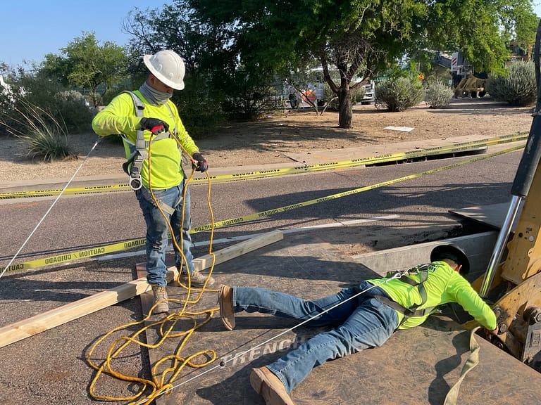 Workers prepping manhole install